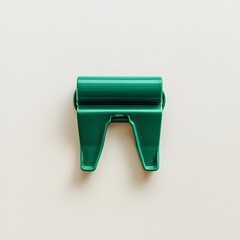 Poster - A close up photograph of a green metal binder clip lying flat at the center of a light colored minimalist background  The image showcases the simple