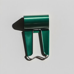 Poster - Closeup of a green binder clip lying flat at the center of a light background  The simple minimalist design of the office supply item creates a clean conceptual image perfect for business school