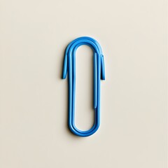 Poster - A minimalist and modern photograph featuring a single blue paper clip placed at the center of a light background showcasing the simple yet essential nature of this common office accessory