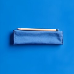 Poster - Minimalist Photograph of a Blue Pencil Case Placed at the Center of a Solid Background Perfect for Professional Product Photography and E commerce Imagery