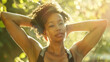 © otter2 - An intimate close-up shot of a woman relaxing after a workout, arms resting behind her head, in a peaceful park setting.