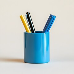 Poster - Neatly Arranged Blue Pen Holder Placed at the Center of a Light Minimalist Background for Corporate Office or Workspace Settings