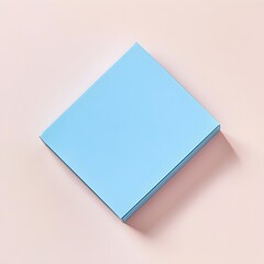 Poster - Closeup of a Blue Minimalist Sticky Note Holder Lying Flat on a Light Surface Isolated and Showcasing a Sleek Organized Office Accessory