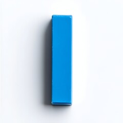 Poster - Closeup of a blue eraser placed at the center of a white background creating a simple and minimalist still life composition for use in commercial educational or creative design projects