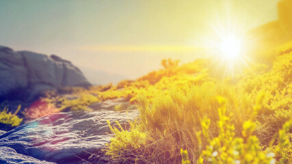 Sunlit mountain landscape at golden hour with sunlit grass and rocky terrain, Adventure or hiking trail summer exploration