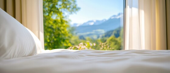 Poster -  A bed with a white comforter, facing a window revealing mountains outside