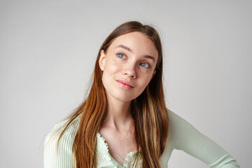 Wall Mural - Young Woman With Long Brown Hair and Blue Eyes