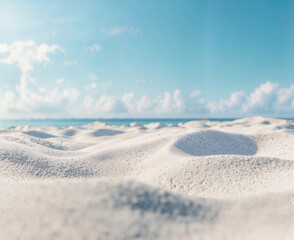 Wall Mural - Fine white sand dunes under the sun on a tropical beach with turquoise water and blue sky