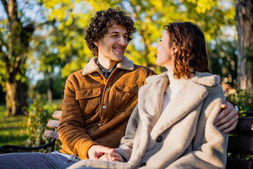 Wall Mural - Portrait of happy loving couple in park.