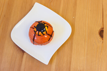 Wall Mural - Creative Halloween cake on wooden table