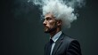 © mischenko - Male businessman in suit and tie with head full of smoke clouds made