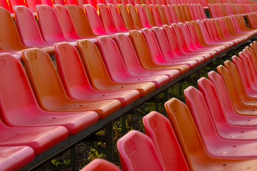 rows of plastic seats in the stadium