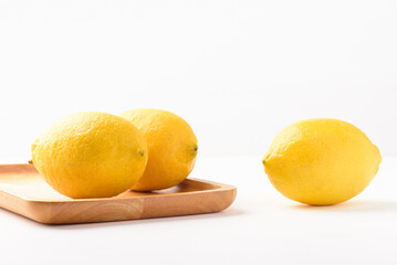 Fresh ripe yellow lemon fruit on white background