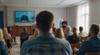 © VistaVisions - Speaker giving presentation in hall at university workshop in front of audience or conference hall. Rear view of participants with softly blurred presenter. Scientific conference event, training