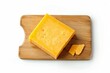 © Taras Vykhopen - a rectangular piece of cheddar cheese on a board on a white background, top view