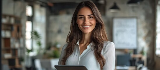 Wall Mural - Confident Businesswoman Holding Tablet in Modern Office Setting with Industrial Design Elements