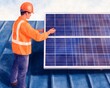 © sorrakrit - A construction worker inspects solar panels on a roof.