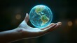 © TatChong - Hand Holding Glowing Digital Earth Globe
