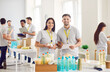 © Studio Romantic - Portrait of happy volunteers, community service staff, at aid center. Team is engaged in charitable work and donations, showcasing commitment to helping others and the positive impact of efforts.