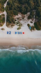 Wall Mural - A beach with a few umbrellas and chairs