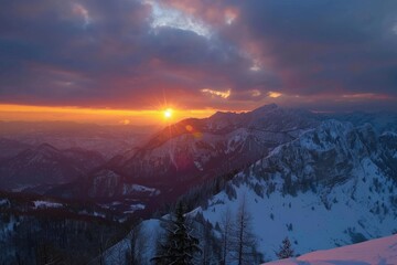 Wall Mural - A serene sunset scene over a snowy mountain range