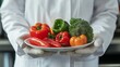 © TensorSpark - Scientist holding plate of fresh vegetables, symbolizing food sensitivity testing and dietary control for gut health.