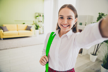 Poster - Photo portrait of cute adorable teen girl take selfie photo backpack wear uniform remote lesson education from home indoors