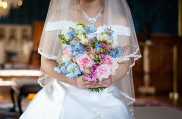 bride and groom with bouquet with wedding dress with necklace 