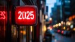 © Maxim Borbut - In the night time, a neon sign showing the year 2025 hangs on a wall in a city