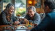© bird_saranyoo - Seniors enjoy playing cooperative games. Share strategies and tips while playing in the living room.