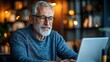 © bird_saranyoo - A Senior man attending online class using laptop By staying active and connected.