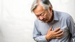 © Bounpaseuth - Senior asian adult elderly man with chest pain suffering from heart attack, health and medical, heart health, heart attack, on white background, copy space for text