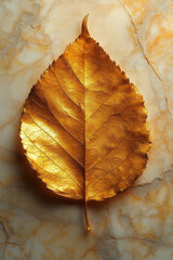 Poster - A gold leaf, isolated on a pastel cream background, symbolizing the use of gold in art and decoration,
