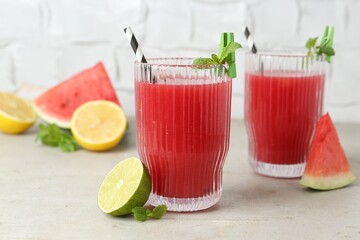 Sticker - Delicious watermelon drink in glasses and fresh fruits on light table