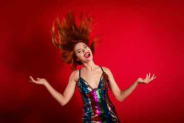 Canvas Print - Photo of gorgeous pretty young woman throw flying hair shiny dress isolated on bright red color background