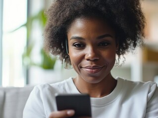 Smiling Woman Engrossed in Smartphone