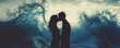 © Thamonchanok - A romantic couple shares a kiss against a dramatic ocean backdrop, conveying love and passion amidst powerful waves.