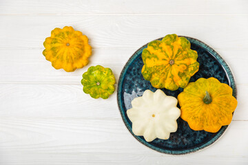 Pattypan zucchini on a textured kitchen table. squash. Fresh organic pattypan squashes on background. Vegan. Farmer's Market. Patisson. Space for text. Copy space.