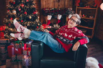 Sticker - Photo of adorable carefree lady dressed red print x-mas pullover spectacles having rest arm chair enjoying new year indoors house room