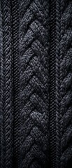 Wall Mural - A close up of a black knit sweater with a zigzag pattern