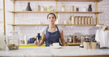 Canvas Print - Happy, barista and working in coffee shop with arms crossed, pride and latte on table in small business. Cafe, waitress or portrait of woman with espresso, tea or service in hospitality or restaurant