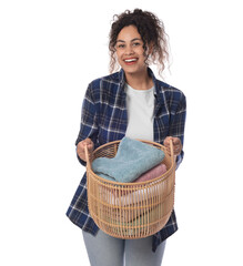 Wall Mural - Happy woman with basket full of laundry on white background