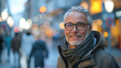 © Kowit - A man wearing glasses and a scarf is smiling in front of a store