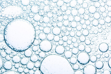 Close-up of bubble texture,Close up macro Aloe vera gel serum cosmetic texture blue background with bubbles. Cruelty free. Lemongrass gel skincare product. antibacterial liquid