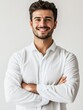 © Thanate - Confident Young Man in White Shirt with Arms Crossed.