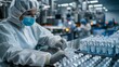 © YURIMA - Workers in protective gear and masks work diligently in a sterile pharmaceutical laboratory, inspecting and processing vials. The focus is on maintaining a high standard of safety and precision.