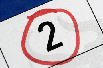 Second number in calendar is circled with red marker.