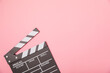 © Avocado_studio - Movie clapper. Movie clapperboard on a bright colored background. Concept of rest and entertainment. Concept of cinema. Film director. Producer. Business and profession. Place for text. Copy space