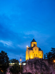 Wall Mural - illuminated Metekhi church in Tbilisi in night