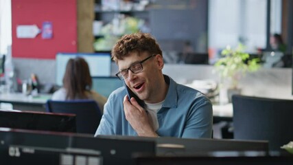 Poster - Cheerful programmer speaking mobile phone in office closeup. Positive man call